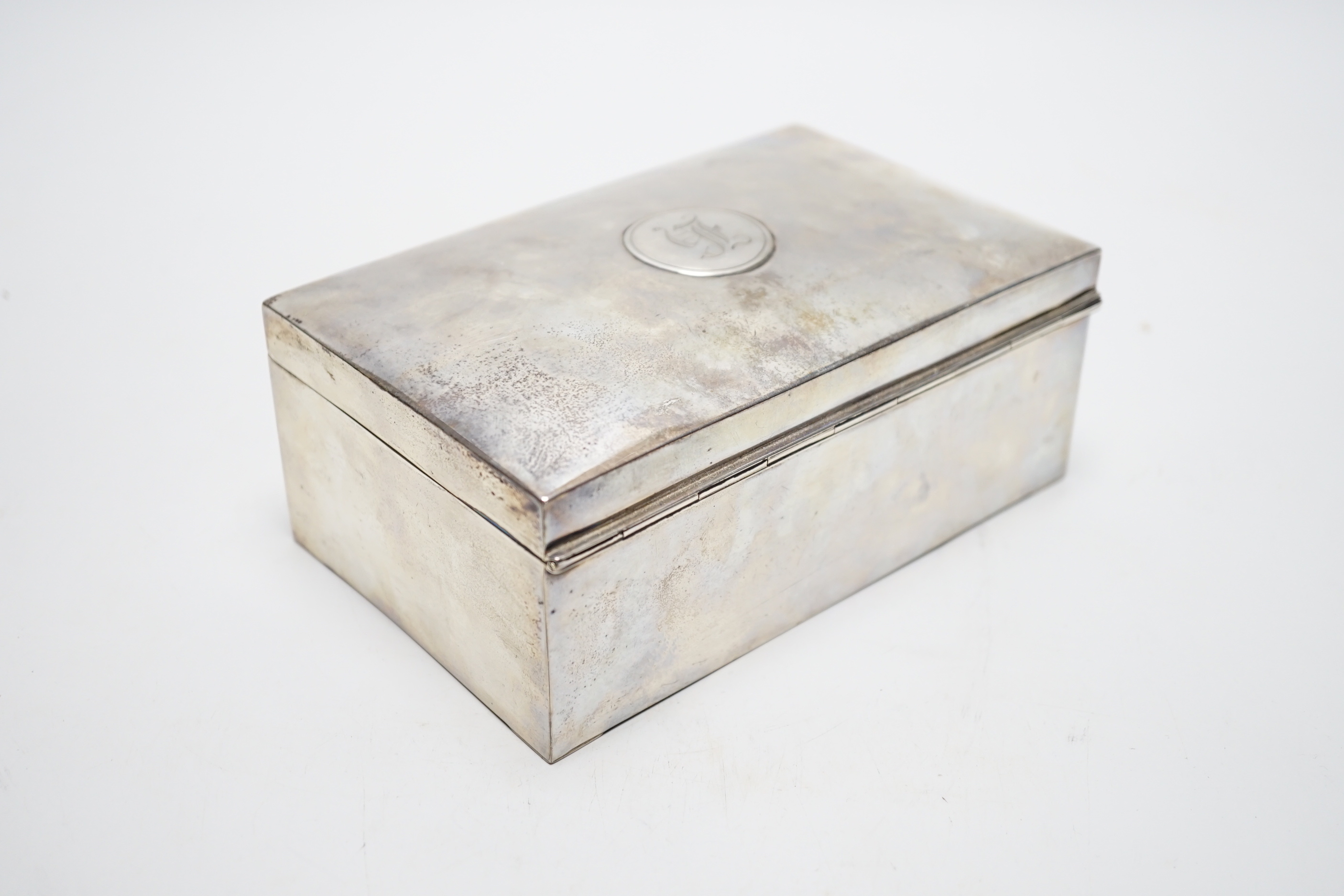 A George V silver mounted rectangular cigarette box, Martin Hall & Co Ltd, Birmingham, 1918, 16.7cm.